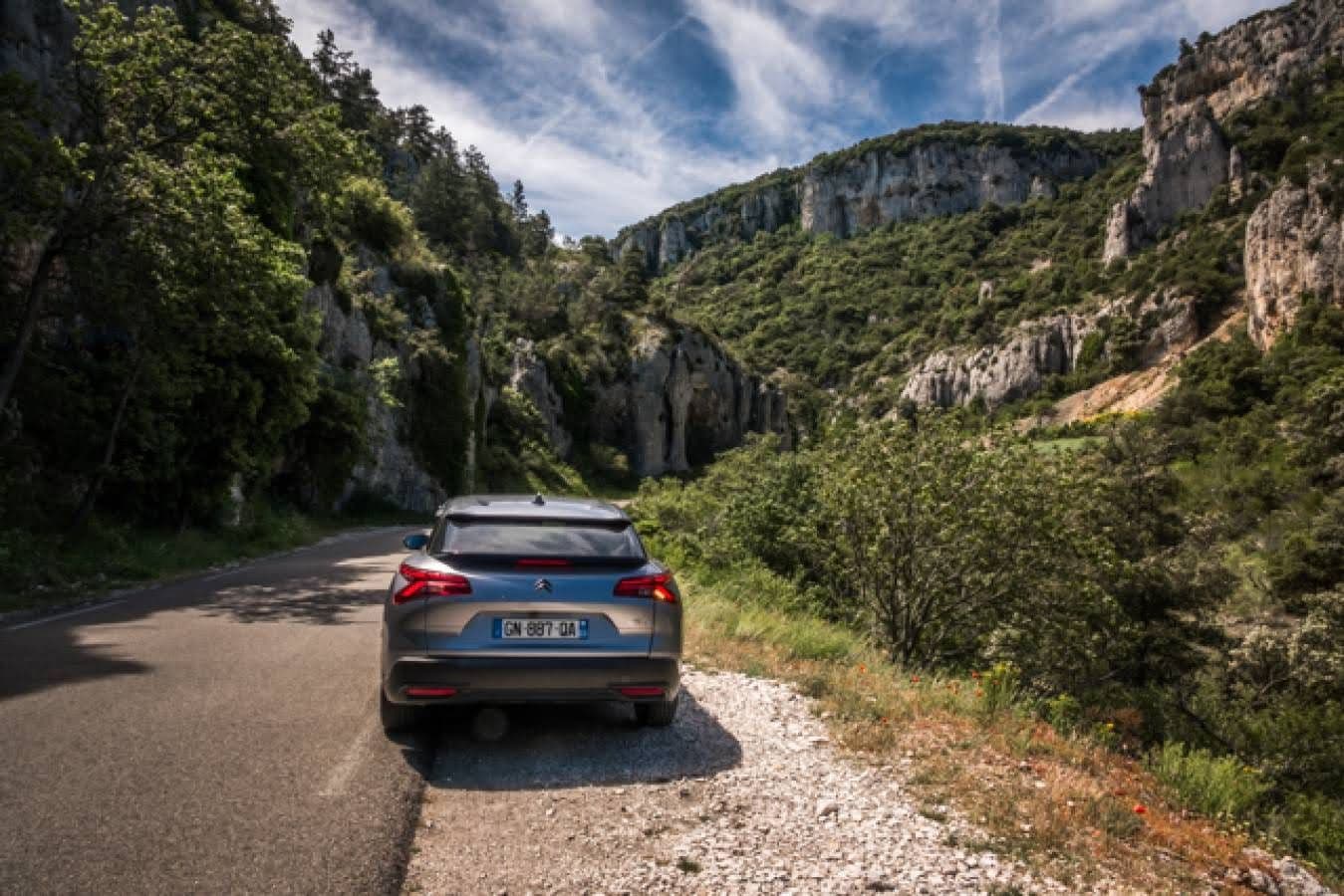 A car parked on the side of the road in a canyon in southern France