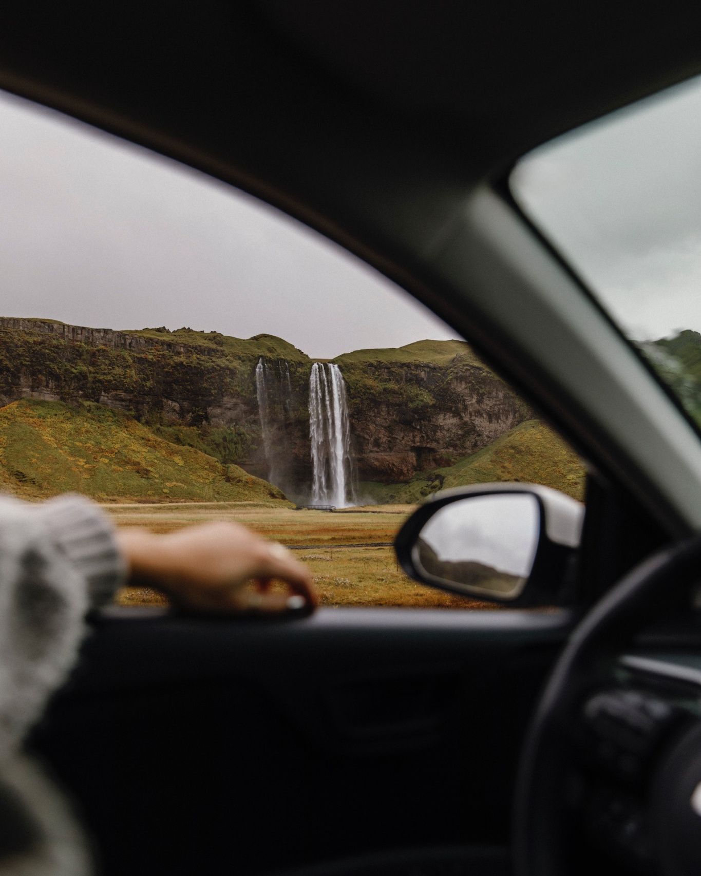 Icelandic waterfall from a car window