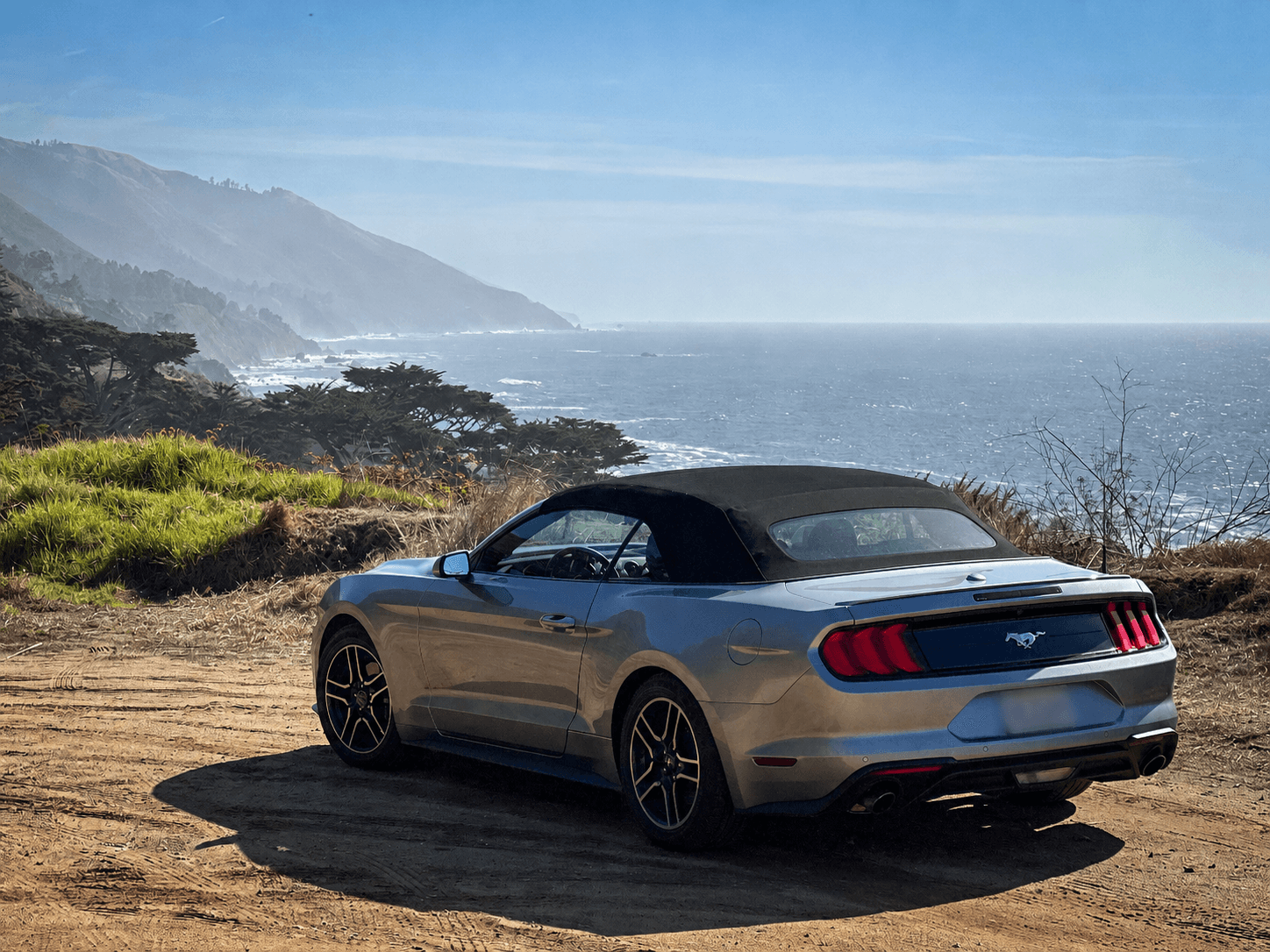 Grey car at a scenic ocean overlook