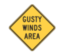 a road sign warning of gusty winds in the area in the United States