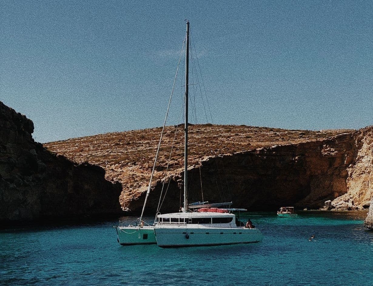 A sailboat in a rocky cove in Malta