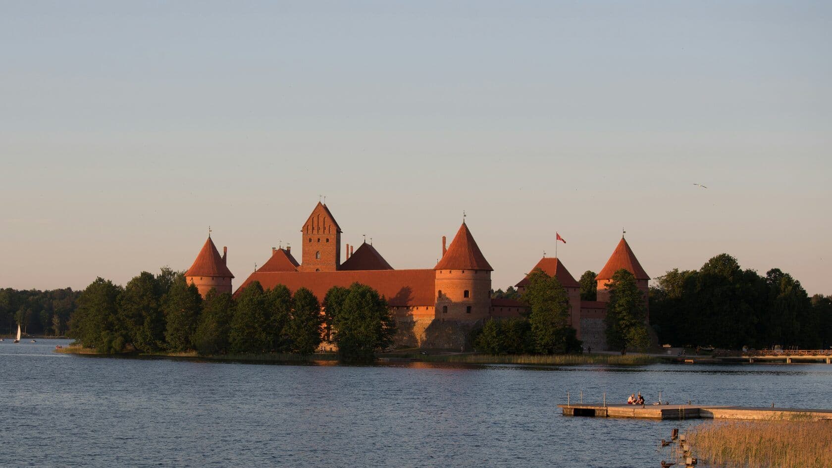 A scenic sunset view of Trakai Castle in Lithuania
